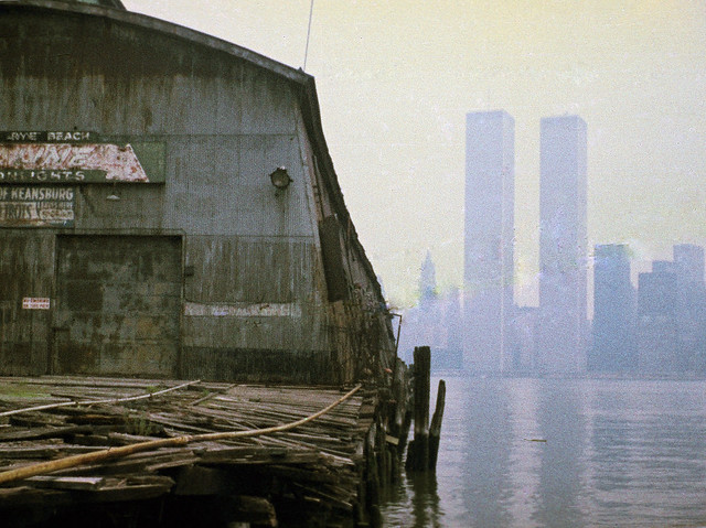Welcome to the good old days in Jersey City. Rotting 19th century piers line the Hudson. The Twin Towers lurk in the fog across the Hudson. March 1975