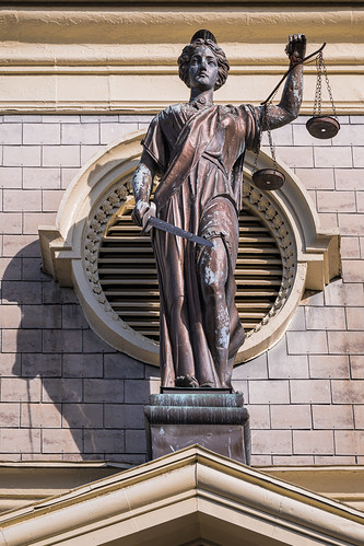 Our Lady Justice was created by Augustus Caesar Yes, THAT &lt;a href=&quot;https://www.history.com/topics/ancient-rome/emperor-augustus&quot; rel=&quot;noreferrer nofollow&quot;&gt;Augustus Caesar&lt;/a&gt;. 

With sword grasped in her right hand and a weight balance in her left, Lady Justice is what the British called her. Here, she is positioned above an American county courthouse. Before she was Lady Justice, she was Justitia, the Roman goddess of justice. We can thank Emporer Caesar Augustus for coming up with her and elevating her to a god. All Roman emperors loved to announce their love of justice to Roman citizens. Rome considered itself the apex of civilization that dispensed just law and order. Justitia epitomized clearheaded thinking and fairness of the state in matters of legal judgment.

Before goddess Justitia, the concept of a goddess of justice came from ancient Egypt. &lt;a href=&quot;https://en.wikipedia.org/wiki/Lady_Justice&quot; rel=&quot;noreferrer nofollow&quot;&gt; Wikipedia explains&lt;/a&gt;, &amp;quot;The personification of justice balancing the scales dates back to their goddess Maat, and later Isis, of ancient Egypt.&amp;quot;