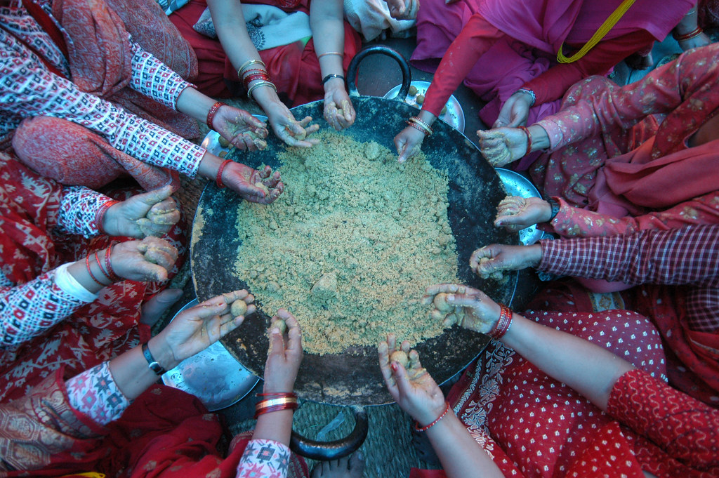 Women making Sweet for ritual Morang