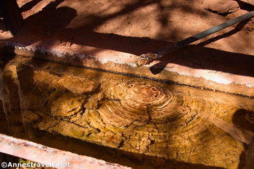 Water dripping out of the pipe into the watering trough at Lou's Spring, Maze District of Canyonlands National Park, Utah