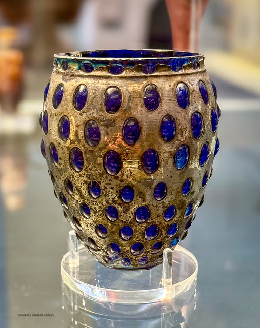 Roman knobbed beaker of blue glass blown into a silver case