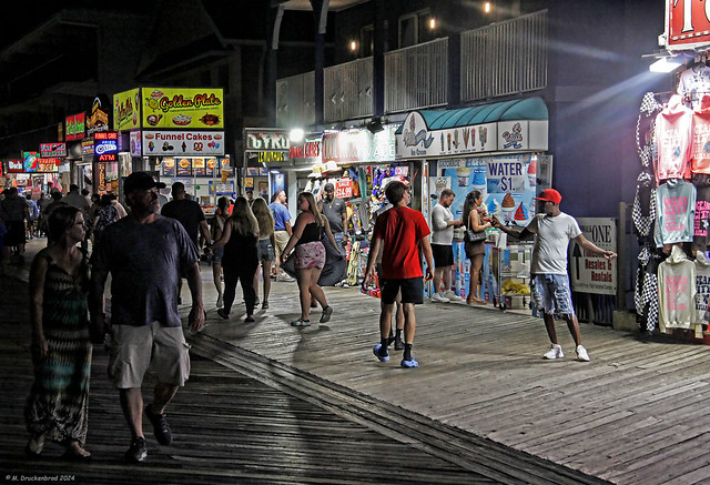 Shops and a T-shirt Vendor on the Ocean City Maryland Boardwalk at night