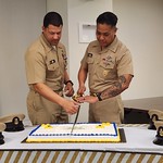 24-0021-103-04 (20240401_101944) 134th U.S. Navy Chief Petty Officer (CPO) birthday celebration at BUMED, April 1, 2024. The two chiefs with the least and most service cut the cake - in this case Chief Holden Roberts and FORCEM PaP Mangaran.Photo by Michael Rhode, BUMED Communications.
