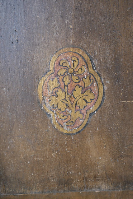 motif on wooden panelled walls