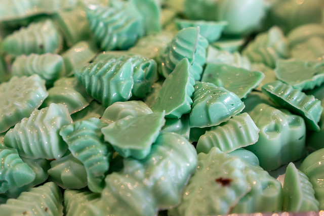 Mint chocolate tiny Christmas candies in green color, in a dish. Homemade holiday treats. In Selective focus