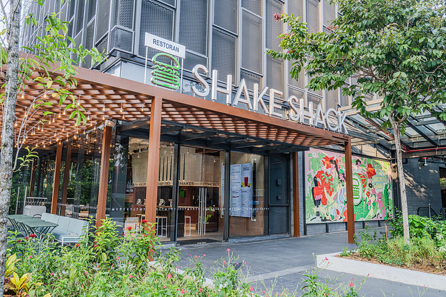 [Photo 1] Shake Shack Malaysia's main entrance with artwork at TRX Exchange