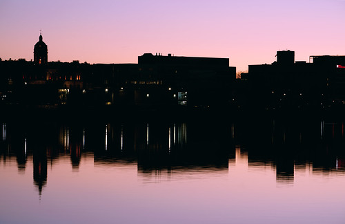 SouthSide Silhouette by Rossatech Studio, Standing on 'The Green' on Fredericton's North Side, facing the southside downtown district. sunset