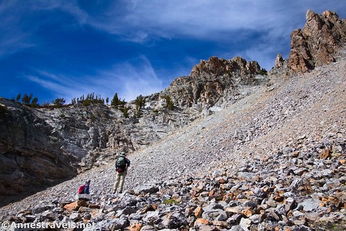 Hiking up the scree to the headwall - if my memory serves me correctly, I ascended in between the two hikers.  Thompson Peak Trail, Sawtooth National Recreation Area, Idaho