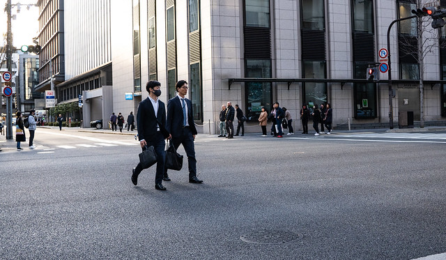 Businessmen jaywalking
