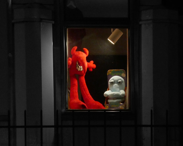 Stuffed demon in the window of White Castle Building No. 8, Lynlake