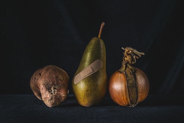 Still life of sweet potato, pear and onion