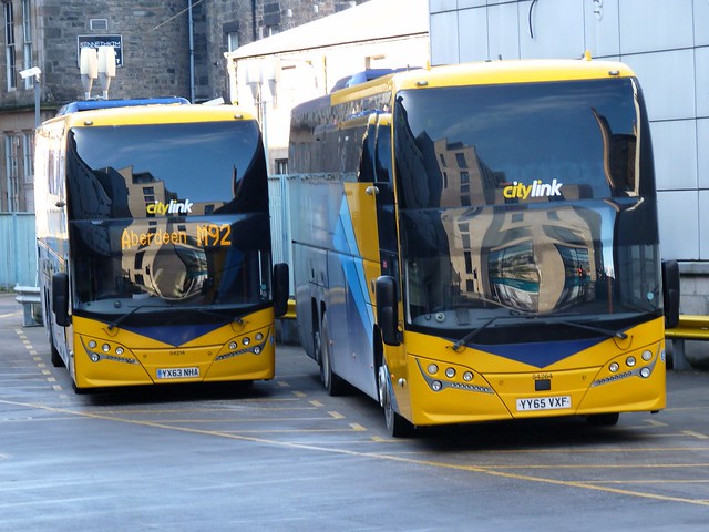 Stagecoach Bluebird Volvo B11RT Plaxton Elite i YX63NHA 54214, in Citylink 6 Cities livery, alongside East Scotland YY65VXF 54264, in generic Citylink livery, laying over at Edinburgh Bus Station on 4 March 2024.