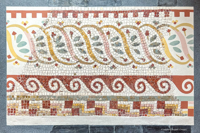 Polychrome mosaic fragment with an undulating ribbon pattern