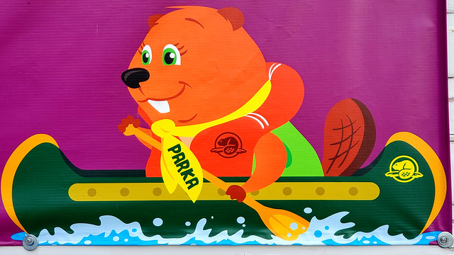 Parks Canada Beaver Mascot Parka, paddling a canoe