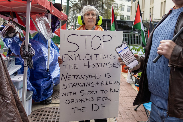 Zionist counter-protesters confront an ongoing Free Palestine protest at the Israeli Embassy