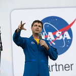 2024 Total Solar Eclipse (NHQ202404080023) Astronaut Reid Wiseman speaks on the main stage at the Kerrville eclipse festival in Kerrville, TX on Monday, April 8, 2024. A total solar eclipse swept across a narrow portion of the North American continent from Mexico’s Pacific coast to the Atlantic coast of Newfoundland, Canada. A partial solar eclipse was visible across the entire North American continent along with parts of Central America and Europe.  Photo Credit: (NASA/Aubrey Gemignani)