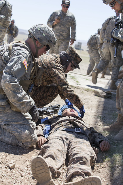 US Soldiers treat simulated casualties during Khaan Quest 2015