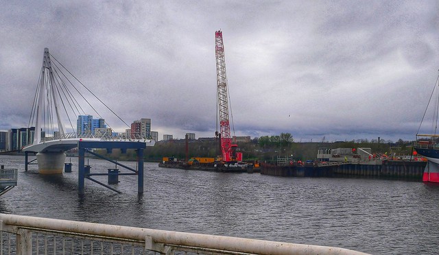 Building a Bridge on a Dull April Morning. Work on the new Pedestrian Bridge over the  Clyde continues