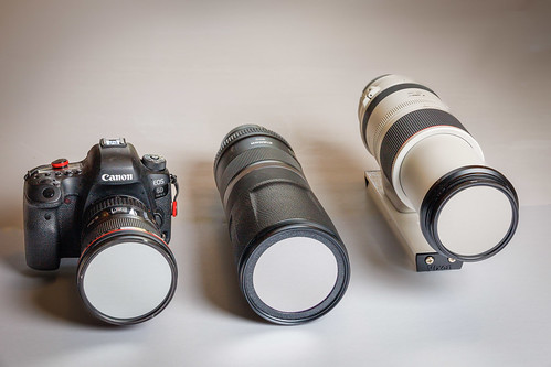 Canon Lenses Outfitted with Solar Filters Left: :EF 16-35mm on a 6D Mark II. This is the camera and lens that I used to make the next composite photo (left arrow).. Center: RF 800mm ƒ11, not used for this eclipse. Right: RF 100-500mm that I used with a 1.4X extender for 700mm. I used this lens on an R5 mounted on a Sky-Watcher SolarQuest solar finder and tracker. It is mounted on a Vixen dovetail bar to fit the SolarQuest.

Strobist: Profoto A2 at camera right in a Profoto Clic Softbox Octa. Triggered by a Profoto Air Remote TTL-C.
