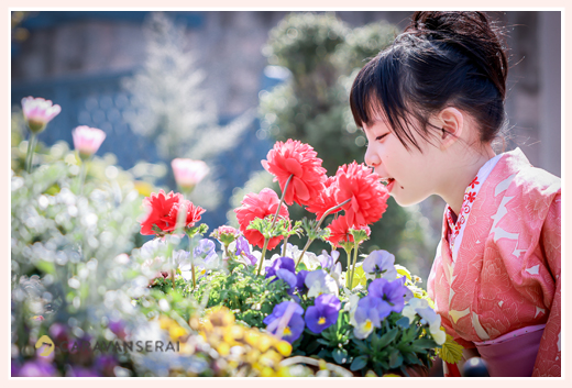 A girl in Kimono visiting Nagoya's Flower Garden, 