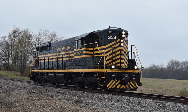 Nickel Plate Road SD9 No. 358 making a shakedown run on the Indiana Northeastern Railroad this morning during a springtime rain shower.