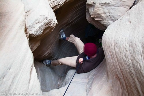 Using the rope to climb down into Round Valley Draw, Grand Staircase-Escalante National Monument, Utah