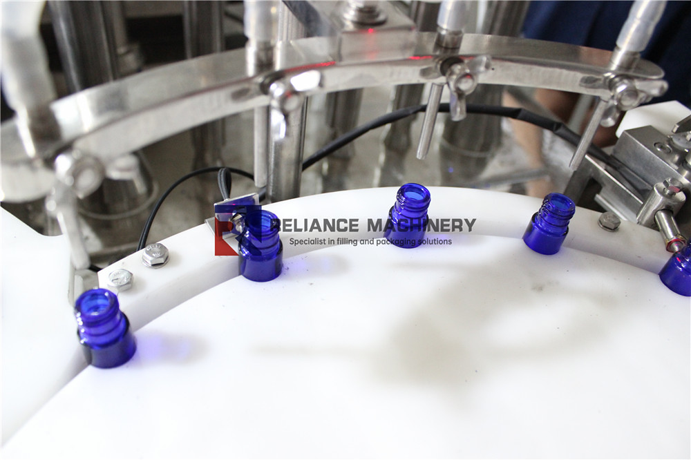 Ceramic-pump-roll-on-bottle-filling-capping-machine-RELIANCE01