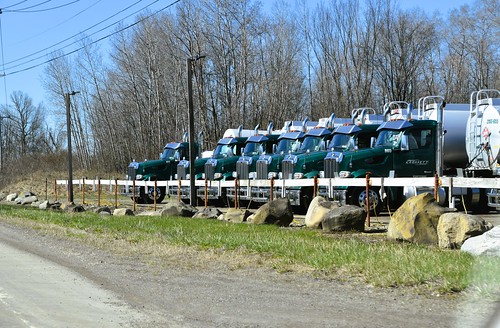 Delivery trucks forming an orderly queue on Route 62, Kennedy, New York (USA) 