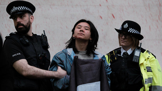 Defiance and Determination. Britain's MOD sprayed blood red to highlight the UK's complicity in Israel's war crimes in Gaza #1