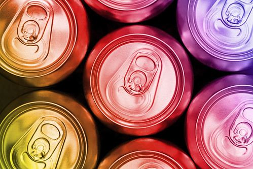 Color soda metal diet energy drinks cans top view background | by CurionInsights