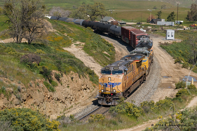 Union Pacific eastbound manifest with 3 units running elephant style prepares to duck into tunnel 3