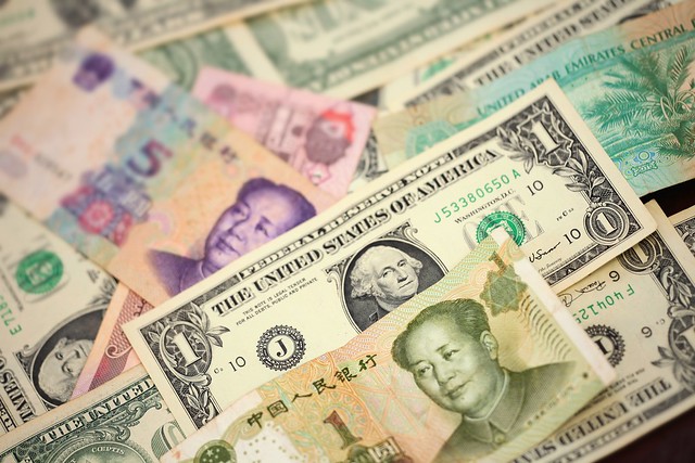 American Dollars And Chinese Yuan Money Banknotes