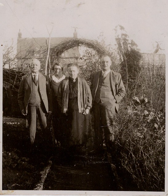My Great-Grandparents with 2 of their 11 children.