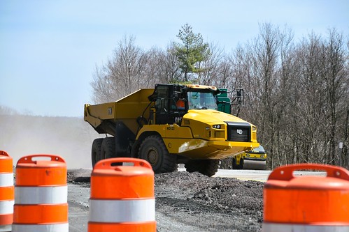 Caterpillar 730 Articulated Haul Truck supporting road re-surfacing activities of highway 17 in the town of Thompson, New York (USA) 