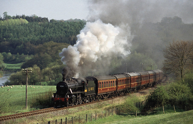 LMS Stanier Mogul no.2968 puts on a fine show as it hauls a northbound rake of maroon LMS carriages alongside the River Severn at Severn Lodge on 1st May 1998.