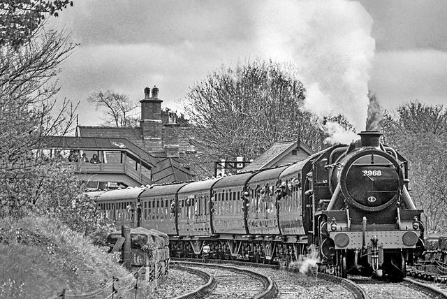 LMS Stanier Mogul no.2968 has steam to spare as it rolls across Wribbenhall Viaduct with a northbound passenger train on 17th April 1993