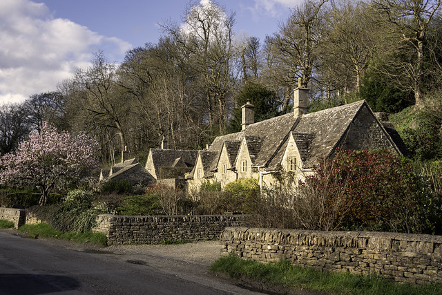 Not quite so tranquil as it looks. Cottages in famous Bibury.