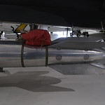 B61 Thermonuclear Bomb Wings Over the Rockies Air and Space Museum

B61 Thermonuclear Bomb 
301 705-00 
B61-7 Type 3E
ALTS 0
SERIAL P758

The B61 nuclear bomb is the primary thermonuclear weapon in the U.S. Enduring Stockpile following the end of the Cold War. When the B61 was still classified, aircrew were not allowed to use the term &amp;quot;B61,&amp;quot; instead they referred to the weapon as a &amp;quot;shape,&amp;quot; a &amp;quot;silver bullet,&amp;quot; or even simply &amp;quot;external delivery.&amp;quot;

Built by the Los Alamos National Laboratory in New Mexico, the B61 began its life as a program for a lightweight, streamlined weapon. Total production of all versions was approximately 3,155, of which approximately 1,925 remain in service, and some 1,265 are considered to be operational.

Nine versions (or &amp;quot;Mods&amp;quot;) of the B61 have been produced. Each shares the same nuclear components but with different yield options. The newest variant, the B61 Mod 11, deployed in 1997, is a ground-penetrating bunker buster for use against targets buried deep underground.

The B61 has been deployed by a wide variety of U.S. military aircraft over the years. Most recently the F-15 Eagle, F-15E Strike Eagle, and F-22 Raptor have been designated as B61 delivery platforms. British, German, and Italian Panavia Tornadoes plus Belgian and Dutch F-16 Fighting Falcons can also carry the B61.

The B61 is a variable yield bomb designed for carriage by high-speed aircraft. It has a streamlined casing capable of withstanding supersonic flight speeds. Most versions of the B61 are equipped with a parachute retarder the weapon in its descent, giving the aircraft a chance to escape the blast (or to allow the weapon to survive impact with the ground). The B61 can be set for airburst, ground burst, laydown detonation, and can be released at speeds up to Mach 2 and altitudes as low as 50 feet.

The U.S. is refurbishing the B61 bombs under its Life Extension Program with the intention that the weapons should remain operational until at least 2025. 

Specifications: 
Length: 11 feet, 8 inches
Diameter: 13 inches
Weight: 700 lbs
Yield: Variable kiloton range