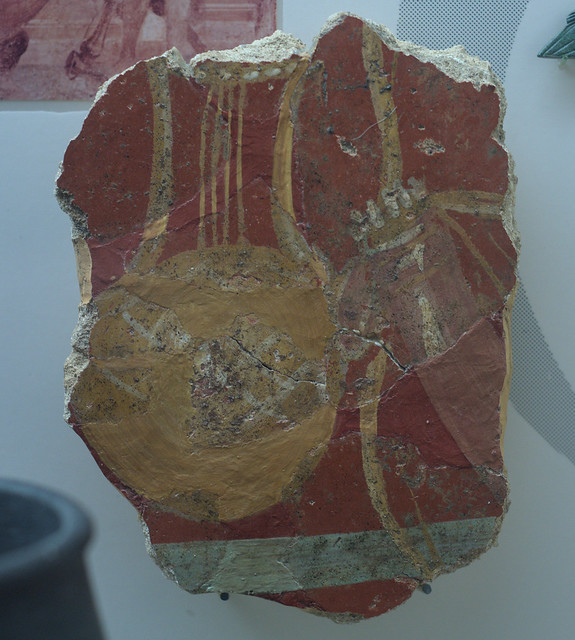 Fragment of Roman fresco representing a lyre, quiver, and bow from Verulamium