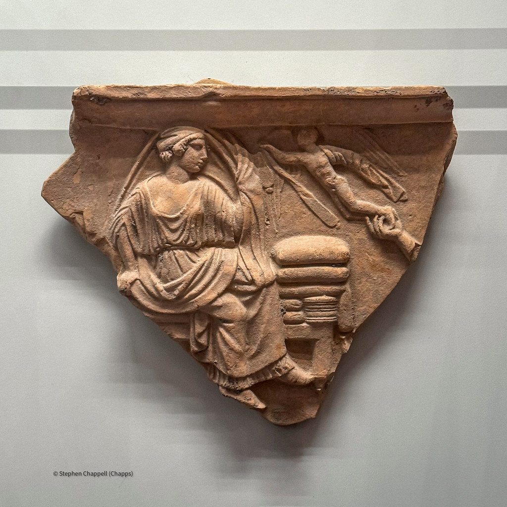Terracotta relief plaque depicting a veiled bride with Eros