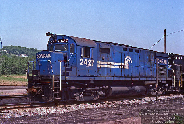 Conrail Alco C425 #2427 {built 2/65 as PRR 2427} sporting a thin wheel on rail logo on the long hood is at Mingo Jct., Ohio on 5/21/77.