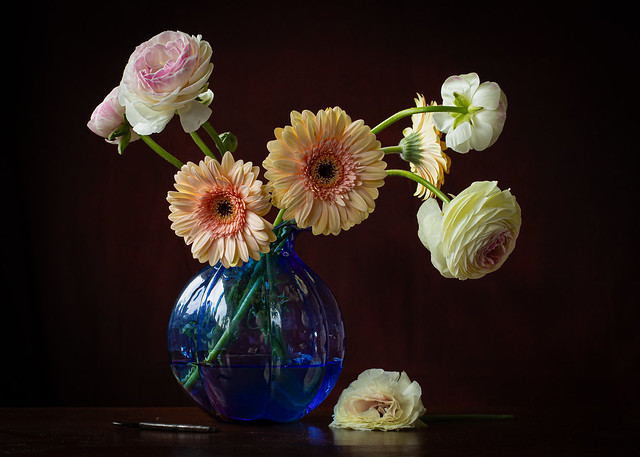 A bunch of flowers in a blue vase