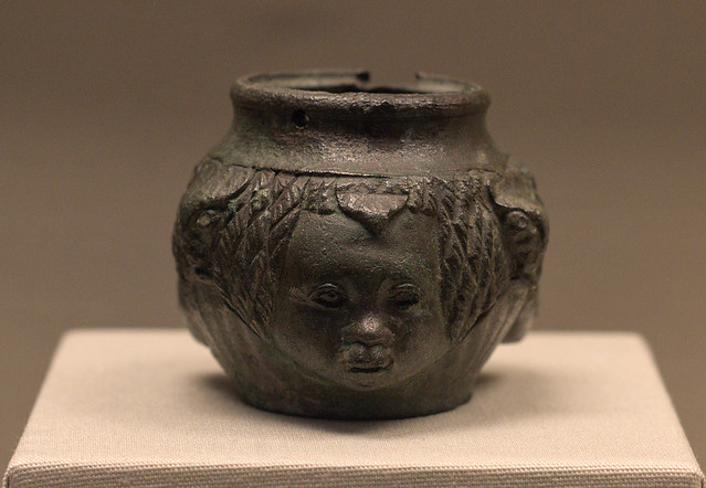 Roman bronze oil flask with head motif