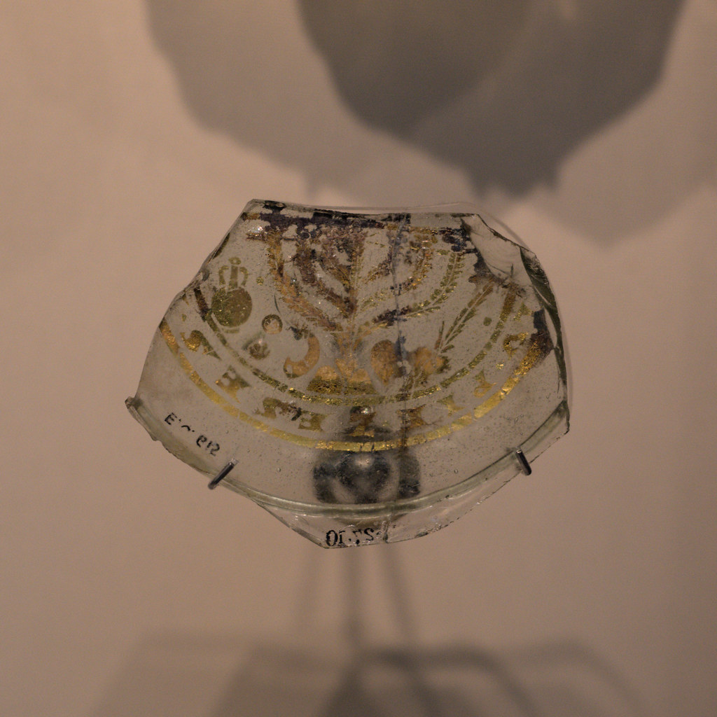 Base of a Roman glass vessel with seven-branched menorah