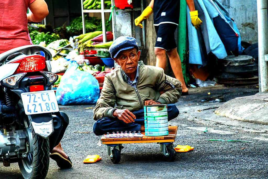 Older, crippled man selling lottery tickets on 4-18-24--Vung Tau copy