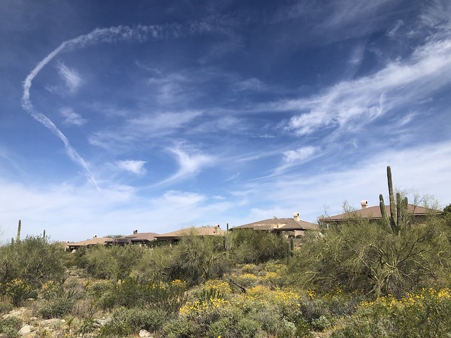 Clouds and vapor trail, sky over McDowell Mountain Ranch, Scottsdale, Arizona