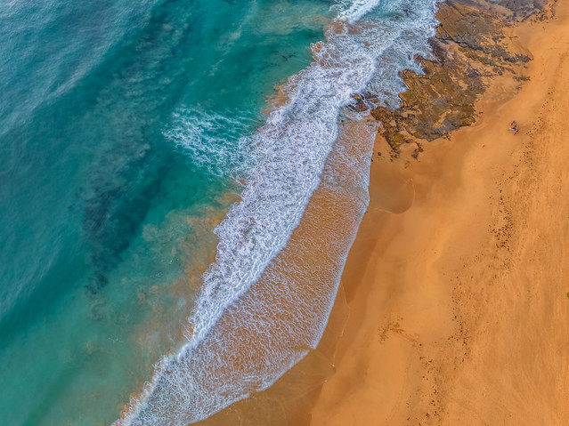 Aerial sunrise at the beach from above