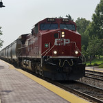 7-25-23, Canadian Pacific AC4400CWM 8164 Rolling east past the Schaumburg, IL Metra station with 182 cars.