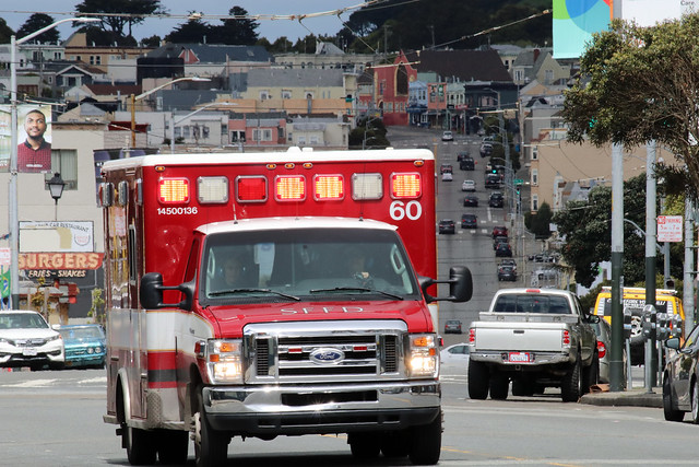 San Francisco Fire Department ambulance responding to call with red lights flashing on Mission Street in the Excelsior District 20190402-144257A
