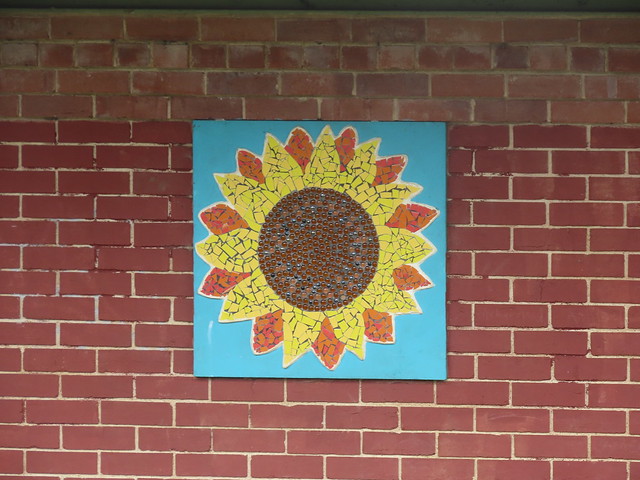 Sunflower sculpture on the Pavilion at Handsworth Park